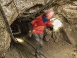 Miner running away from danger