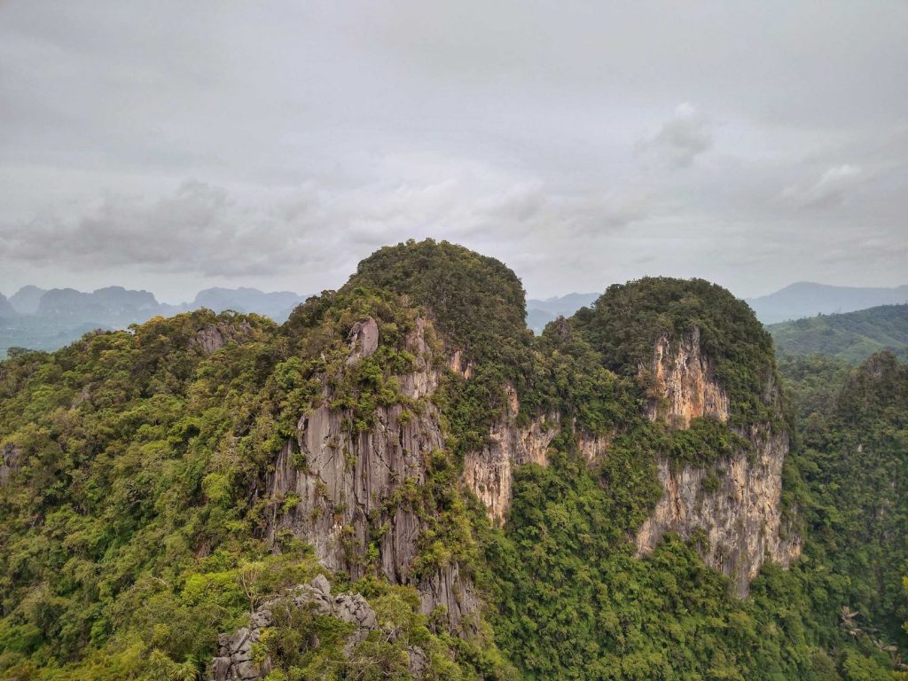 Panoramic view of limestone cliffs from Tiger Temple Cave