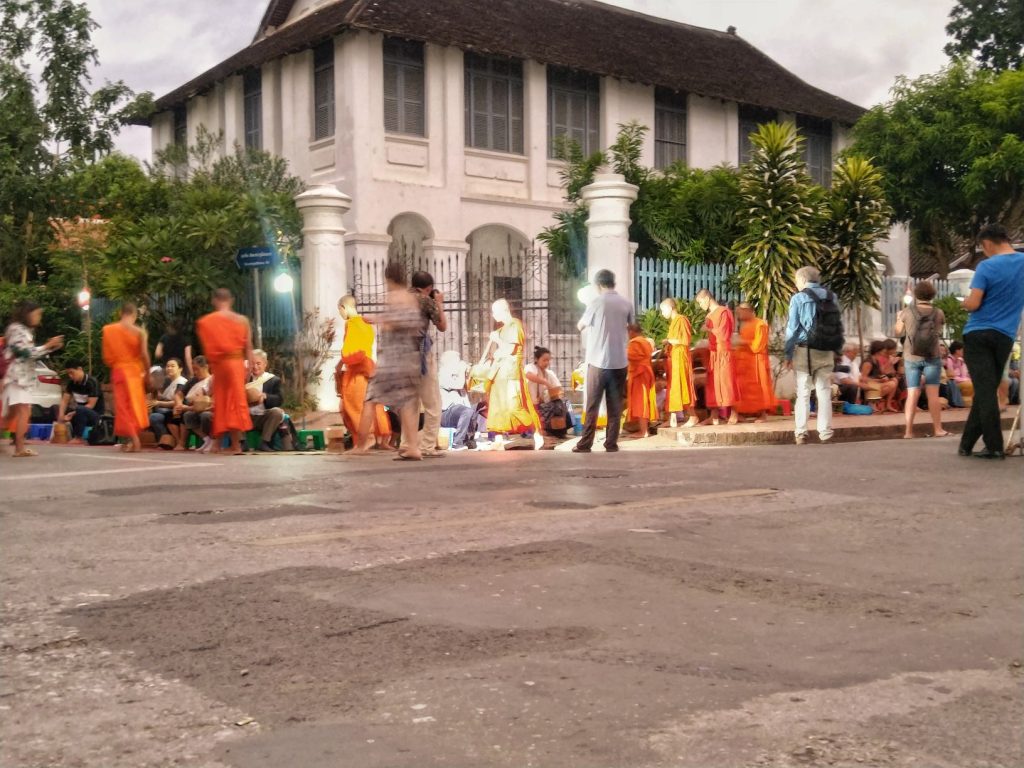 Tourists disrespect the Monks in Luang Prabang by flashing cameras in their faces