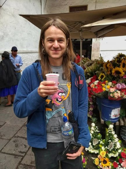 Drinking a flower elixir in Cuenca, Ecuador